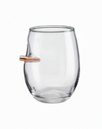 Clear wine glass with a bullet-shaped object inside on a white background from American brand Benshot available at Spacio retail stores in Mumbai & Kolkata. 