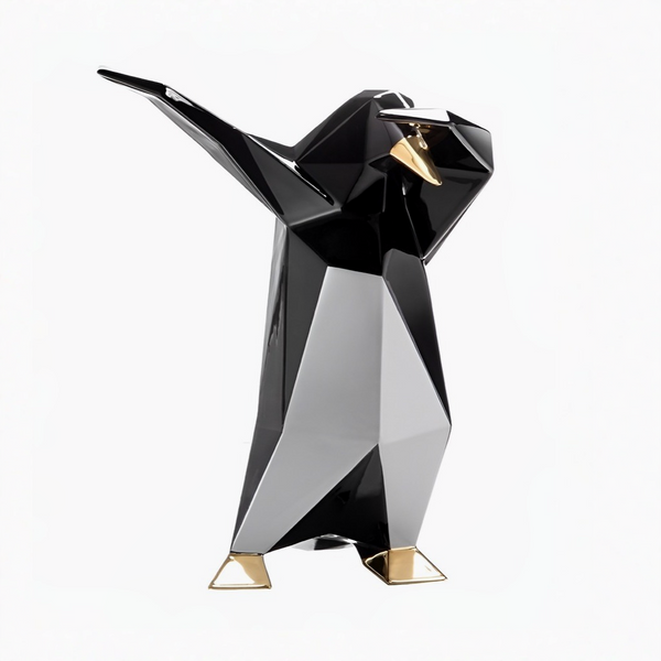 Black and gold penguin sculpture on a white background