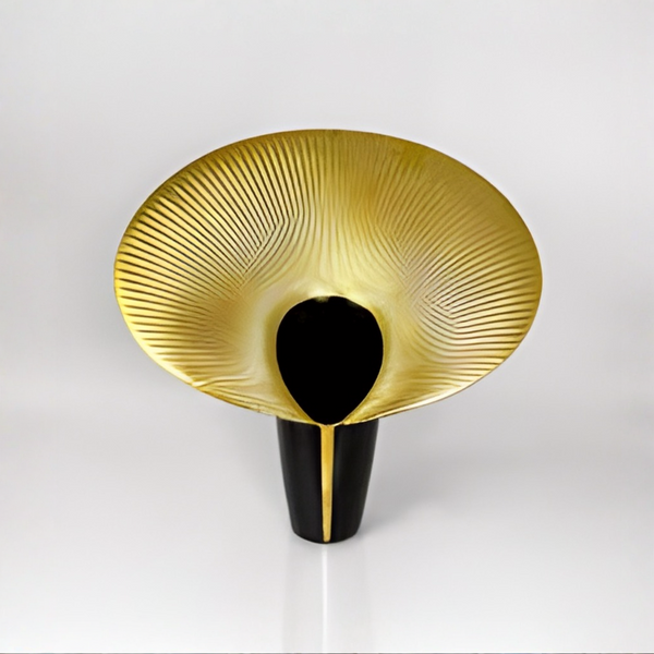 Decorative vase with gold and black design on a white background