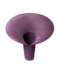 Purple ceramic vase with textured surface on a white background