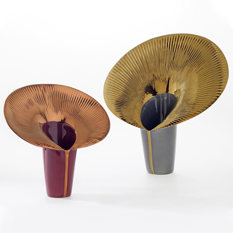 Two unique ceramic vases with textured surfaces on a white background