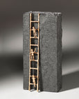 A Butzon & Bercker sculpture depicting a ladder with two people on it, serving as a motivational symbol for success and achievement in the SEO industry.