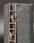 A Butzon Bercker Sculpture Aspire to the Top, a motivational sculpture of a ladder with two people on it, reflects determination and perseverance in the business world.