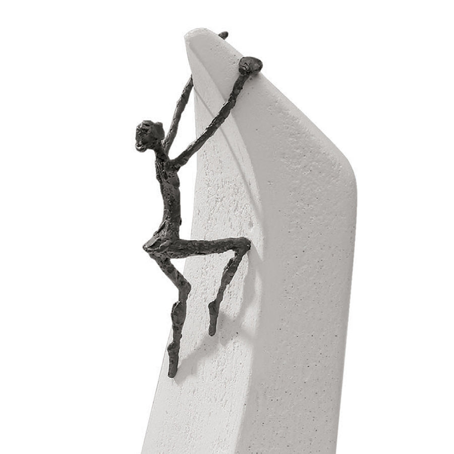 A Butzon Bercker sculpture of a man on a surfboard, representing the idea that everything is possible.