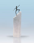 An inspiring Butzon Bercker sculpture called "Steps to Success" of a determined man triumphantly standing on top of a stair, symbolizing the brand's commitment to success and motivation.