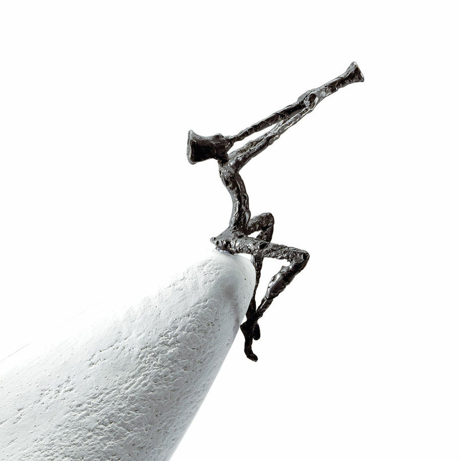 A high-quality Butzon Bercker sculpture of a man playing a trumpet on top of a pencil, entitled "Butzon & Bercker Sculpture Zest For Life II".