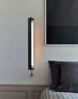 In the tube wall light from DCW Editions in a bedroom