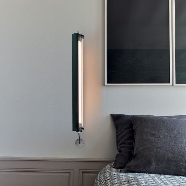 In the tube wall light from DCW Editions in a bedroom