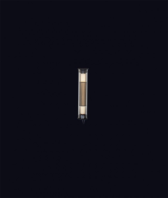 In the tube wall light from DCW Editions on a black background