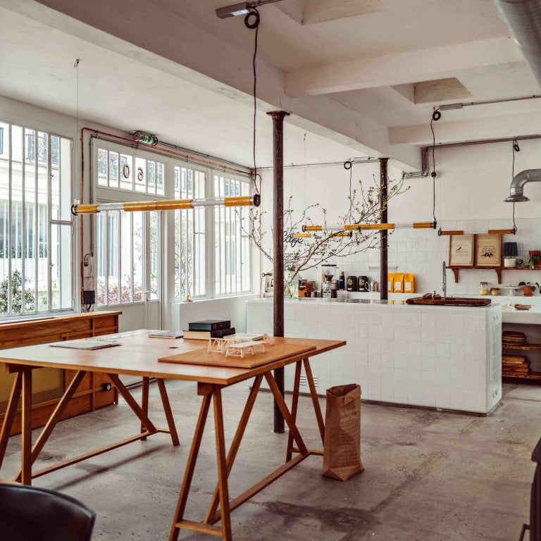 In the tube suspension lights from DCW Editions in a cafe