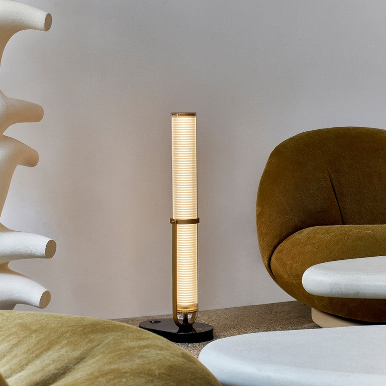 La Lampe Frechin table lamp on the floor by DCW Editions 