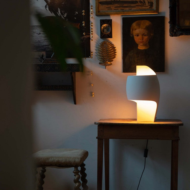 Sculptural table lamp from DCW Editions in a dark room