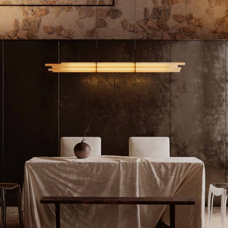 NL12 Suspension chandelier from DCW Edition  above a dining table