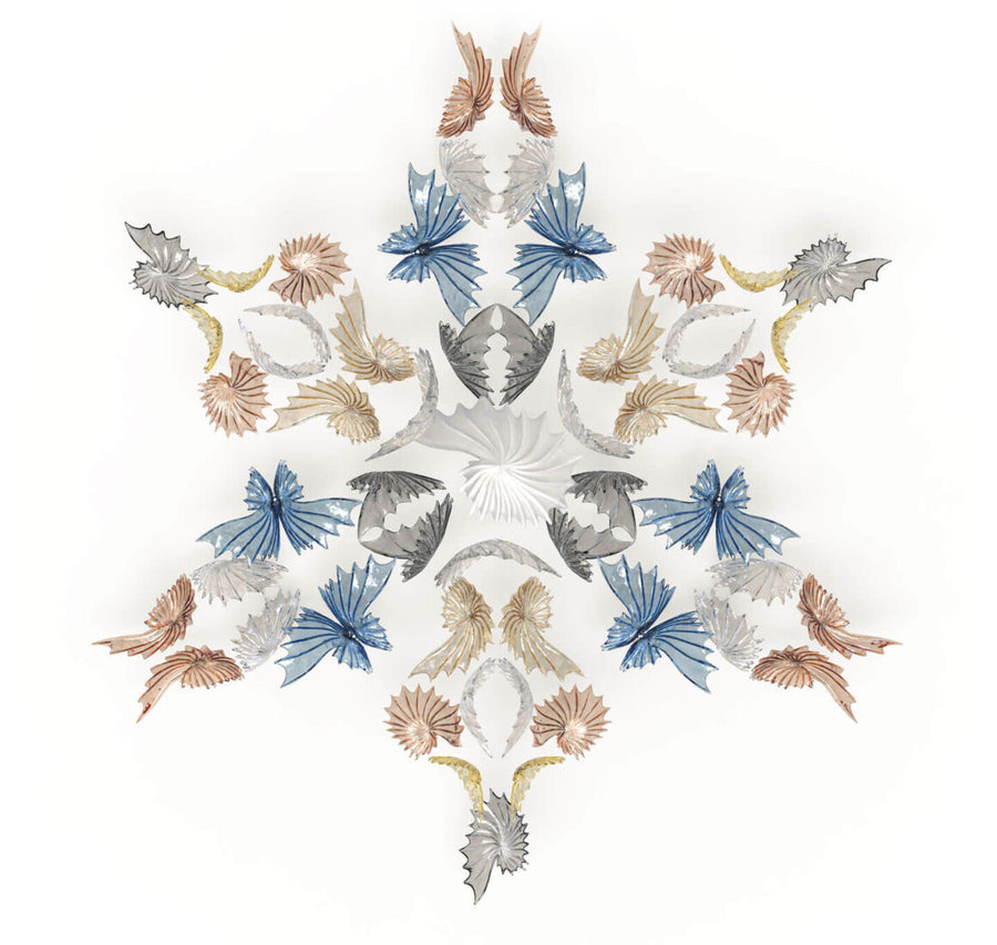 Decorative pattern with Dalia elements on a white background from Italamp's Kaleido  collection available at Spacio in India. 