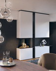 Modern wall-mounted cabinetry with a built-in linear gas fireplace, shown in a styled interior room with a dining table, chair, glass pendant lights, and decor.