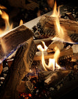 Gas fireplace logs and real-looking wood embers with bright orange and yellow flames dancing in a dark, realistic firebox setting.