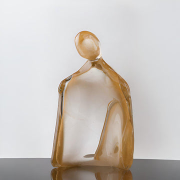 Glass sculpture of a woman with 24K gold dust on a white background titled HER from Duccio Di Segna, available at Spacio retail stores in Mumbai & Kolkata. 