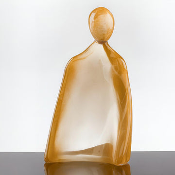 Glass sculpture of a man with 24K gold dust on a white background titled HIM from Duccio Di Segna, available at Spacio retail stores in Mumbai & Kolkata. 