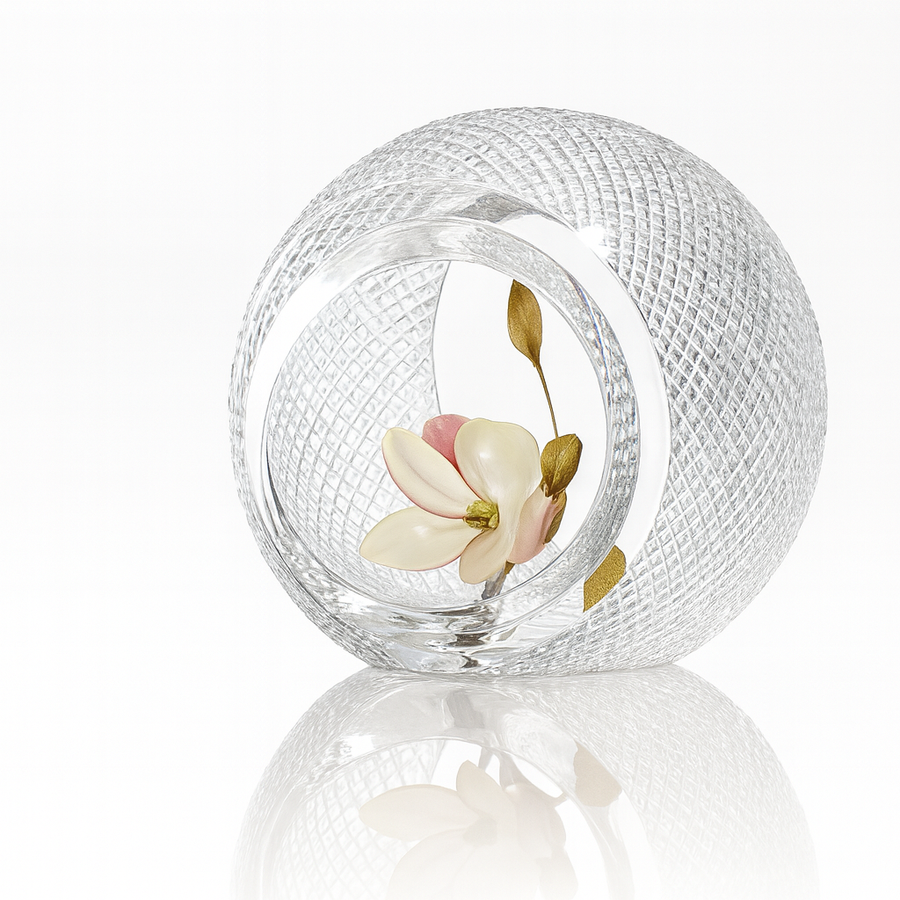 Diamond cut crystal sculptural vase containing a decorative flower on a white background from Duccio Di Segna available at Spacio retail stores in Mumbai & Kolkata. 