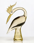 Gold swan-shaped object on a white background