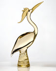 Gold bird sculpture on a white background