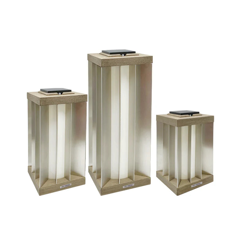 Three rectangular indoor outdoor solar lamps with a white interior on a white background by Les Jardins available at Spacio retail stores in Mumbai & Kolkata. 