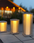 Set of three indoor outdoor solar lantern lights on a patio with a blurred background  by Les Jardins available at Spacio retail stores in Mumbai & Kolkata. 