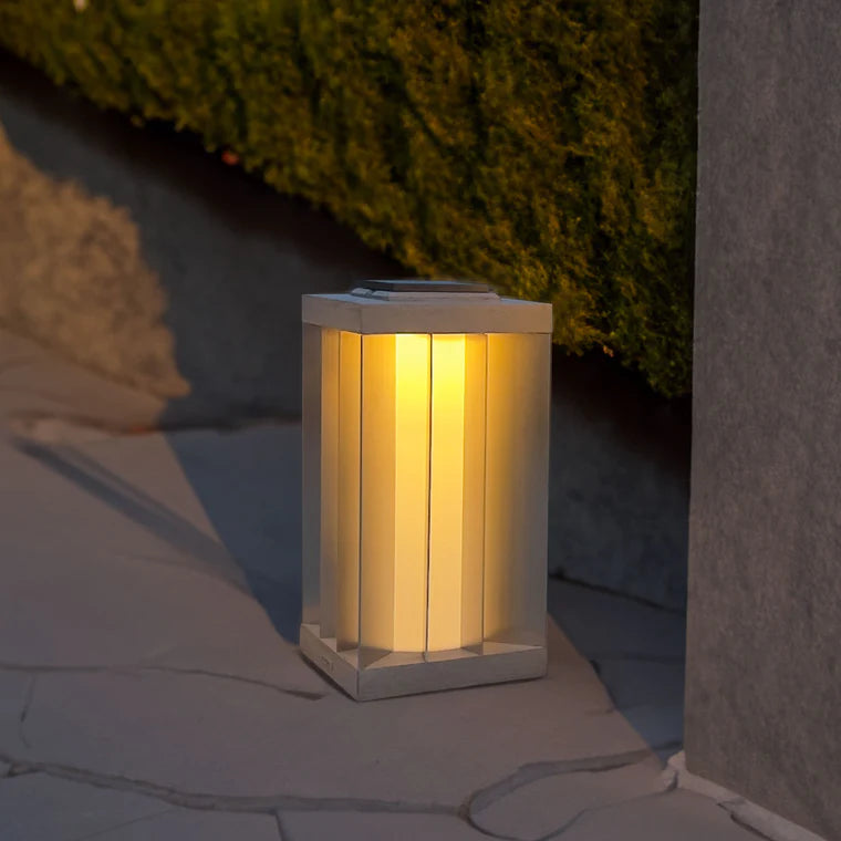 Solar-powered indoor outdoor light fixture on a stone surface with greenery in the background by Les Jardins available at Spacio retail stores in Mumbai & Kolkata. 