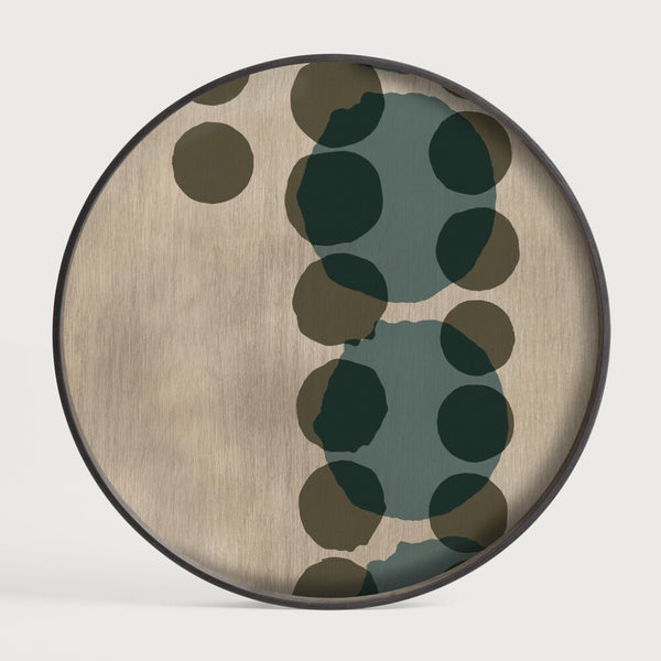 Round wooden wall art panel cum serving tray with green and brown polka dot pattern on a white background