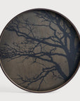 Round all art panels cum serving tray with tree branch design on a white background
