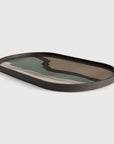Wall art cum serving tray with a wavy design on a light gray background