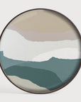 Round wall art with abstract mountain landscape design on a white background