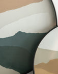 Abstract wall art cum serving tray featuring layered organic shapes in beige, white, and dark green, with overlapping circular elements and black rims.