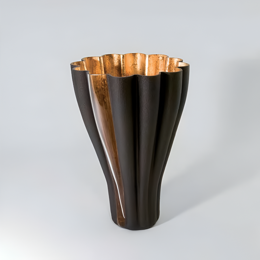 Vase with dark brown and gold design on a gray background by Evans Atelier available at Spacio retail stores in Mumbai & Kolkata. 