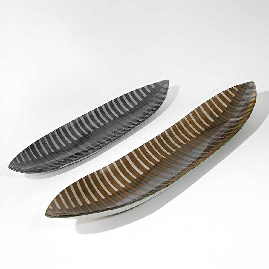 Two glass platters with striped patterns on a white background by Evans Atelier available at Spacio retail stores in Mumbai & Kolkata.