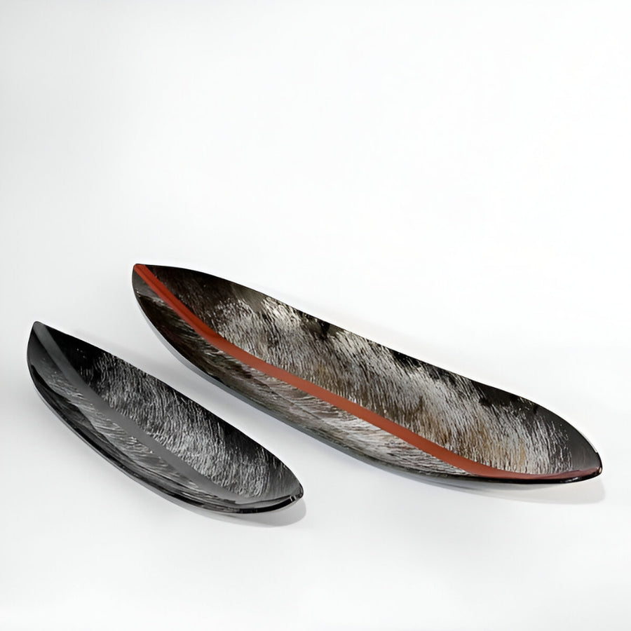 Two decorative plates with a unique design on a white background by Evans Atelier available at Spacio retail stores in Mumbai & Kolkata. 