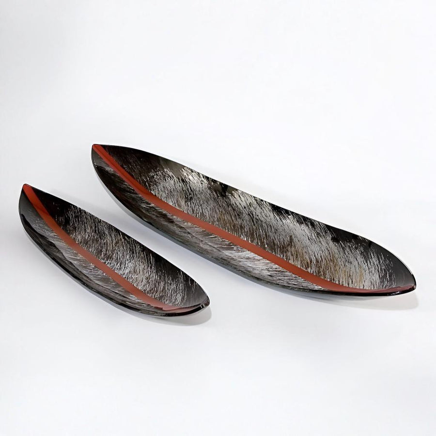 Two decorative glass plates with a modern art and red trim on a white background by Evans Atelier available at Spacio retail stores in Mumbai & Kolkata. 