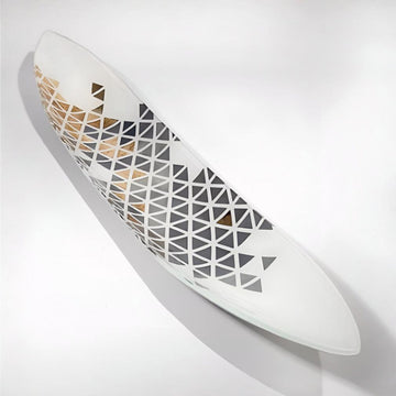 White glass platter with geometric pattern on a light gray background by Evans Atelier available at Spacio retail stores in Mumbai & Kolkata. 