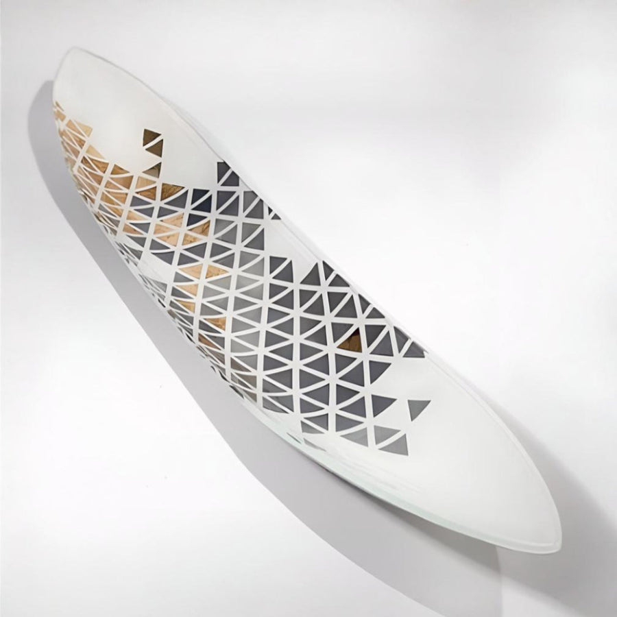 White glass platter with geometric pattern on a light gray background by Evans Atelier available at Spacio retail stores in Mumbai & Kolkata. 