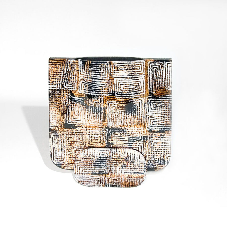 A glass vase with geometric pattern on a white background by Evans Atelier available at Spacio retail stores in Mumbai & Kolkata. 