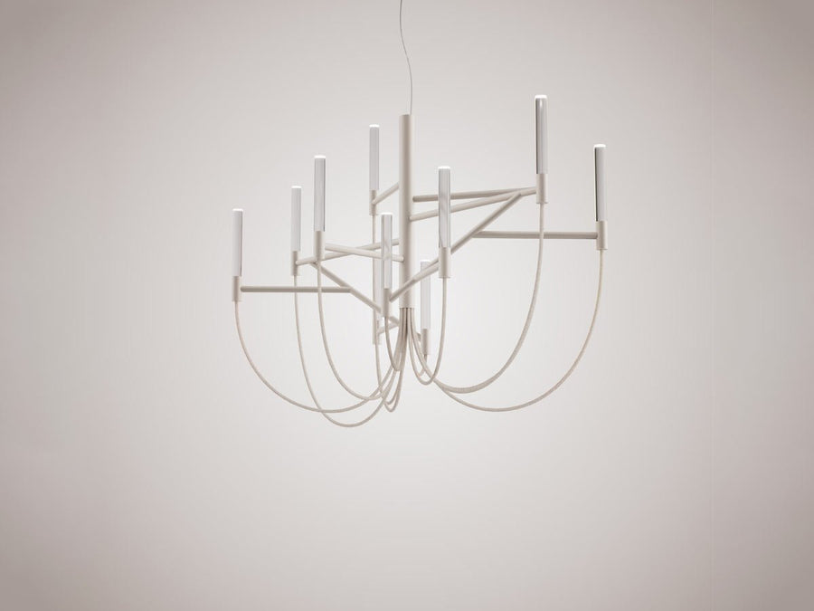 Modern chandelier with white metal design on a plain background