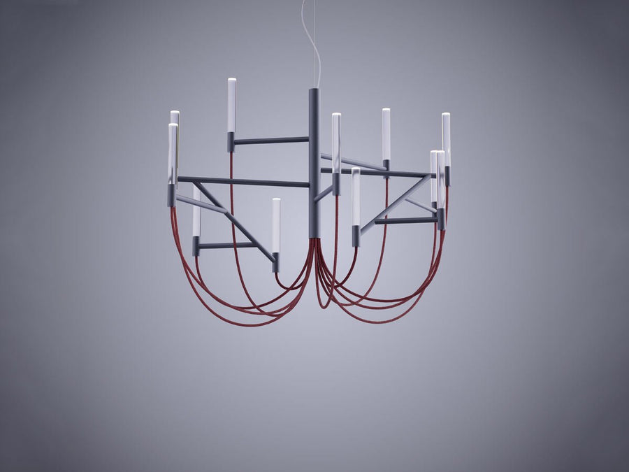 Modern chandelier with red cables on a gray background