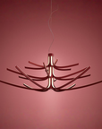 Modern chandelier with a unique design on a red background