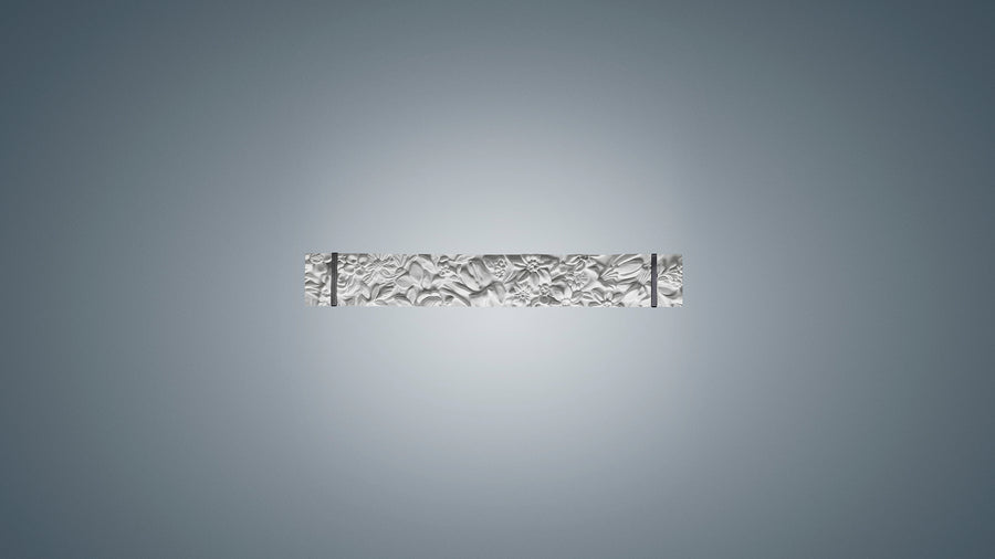 Decorative wall sconce with intricate design on a gray background