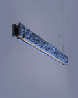 Modern pendant light fixture on a neutral background