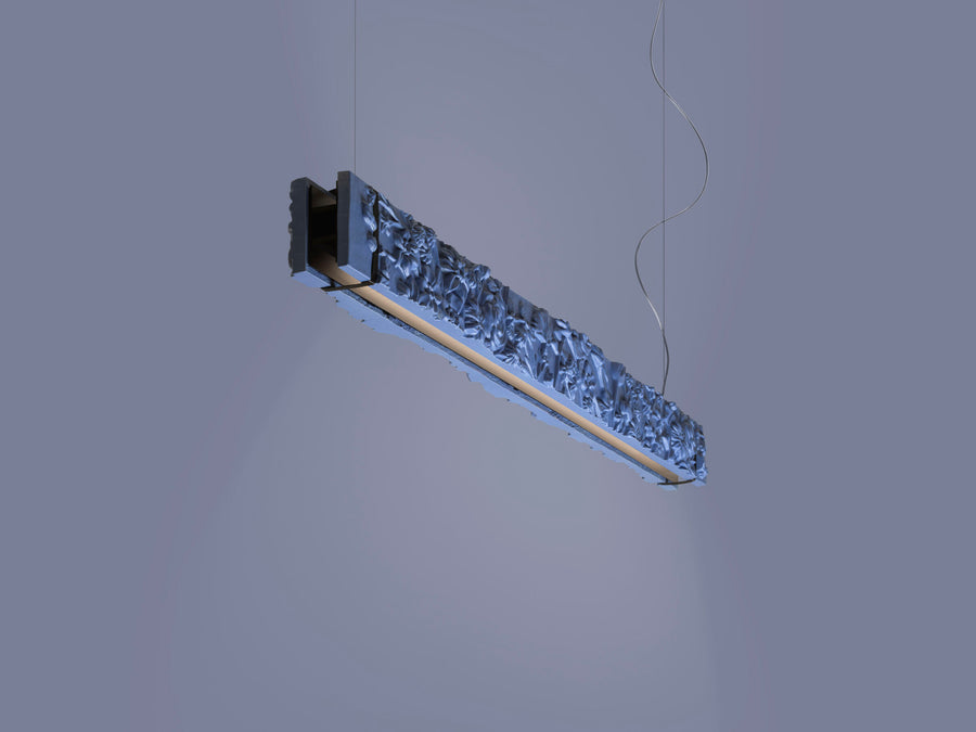 Modern pendant light fixture on a neutral background