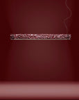Decorative suspension light fixture on a dark red background