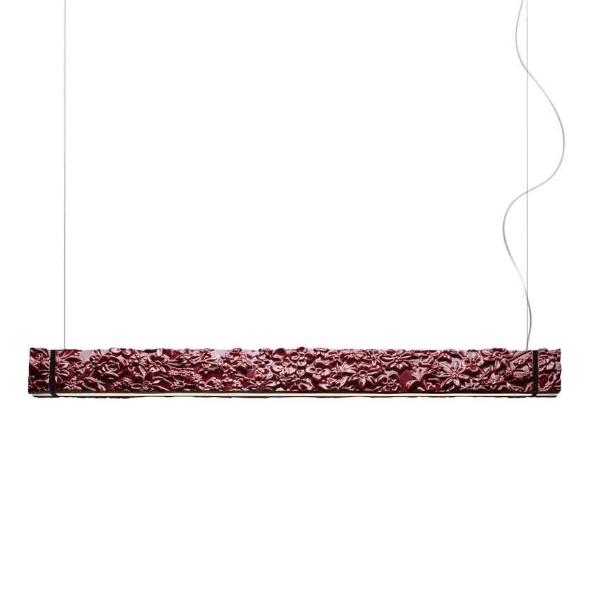 Decorative rectangular ceramic suspension lamp with intricate patterns on a white background from Foscarini available at Spacio retail stores in Mumbai & Kolkata.