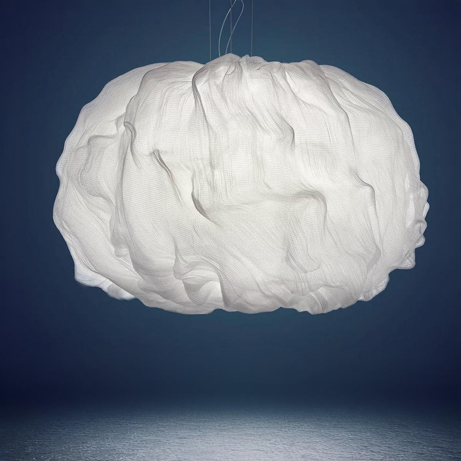 White cloud-shaped lamp against a dark blue background