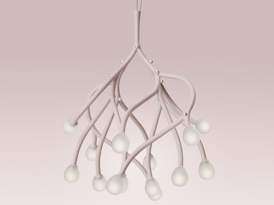 Modern chandelier with white branches on a pink background